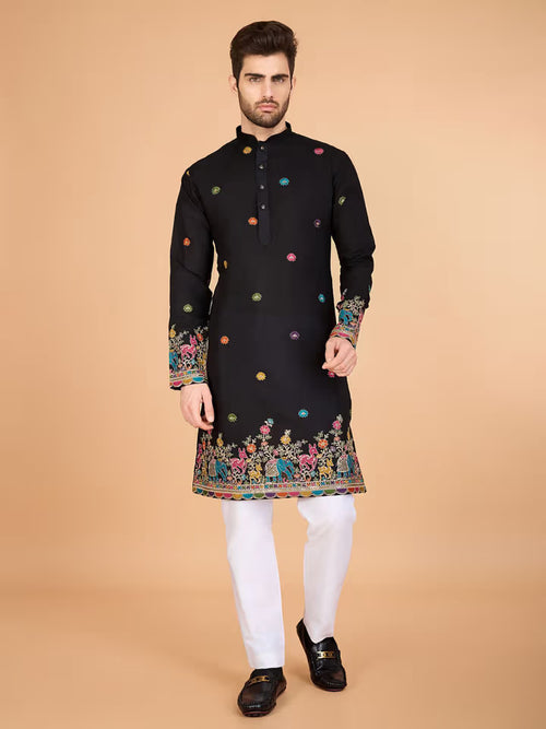 Men’s black kurta with colorful embroidery and festive border – ethnic wear for weddings and celebrations