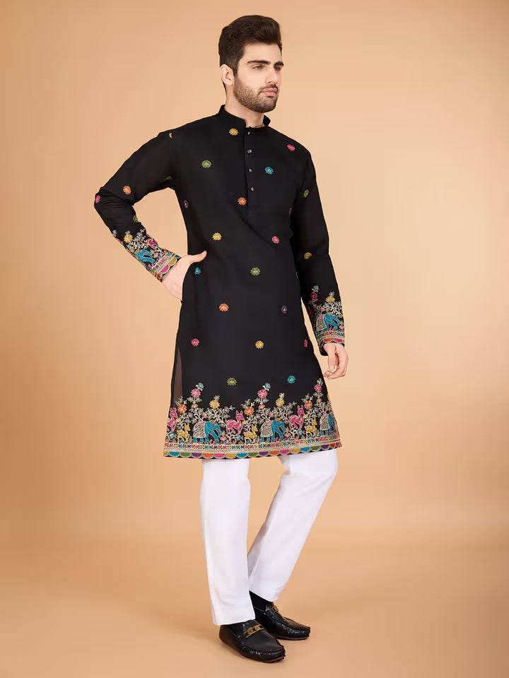 Men’s black kurta with colorful embroidery and festive border – ethnic wear for weddings and celebrations