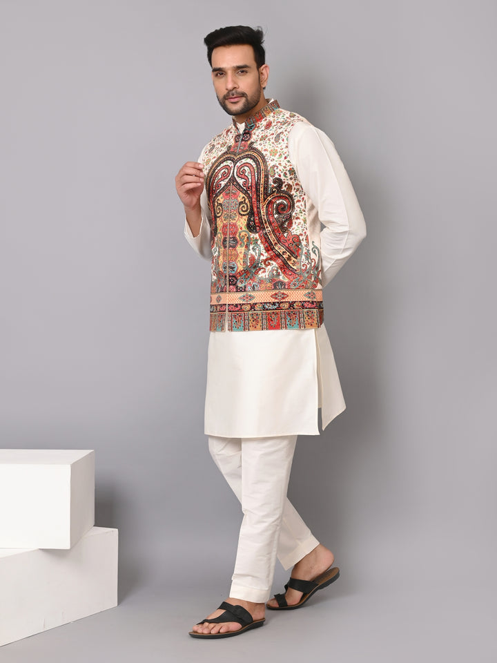 Man wearing a traditional kurta with a colorful pattern on a gray background