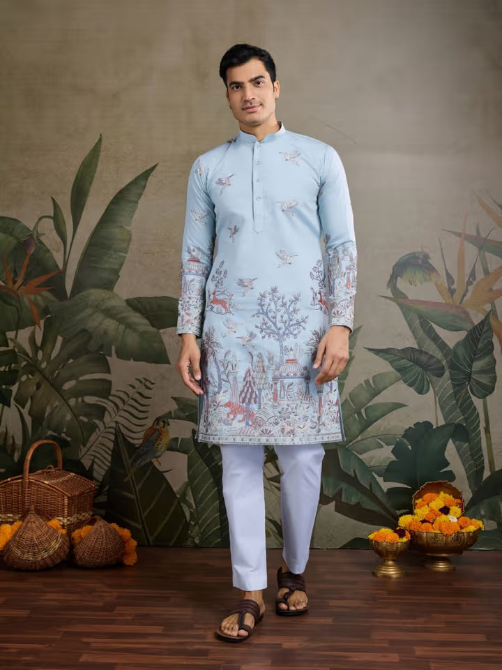 Model wearing a sky blue embroidered kurta for men with white pajama – perfect for weddings and festive occasions