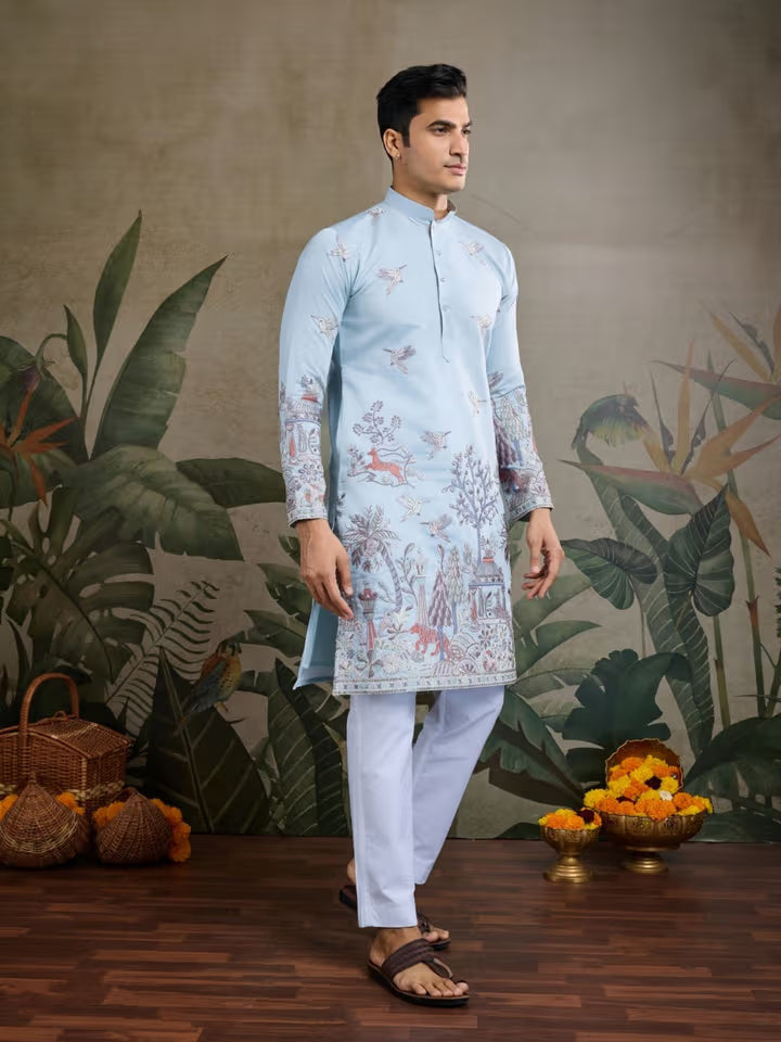 Model wearing a sky blue embroidered kurta for men with white pajama – perfect for weddings and festive occasions