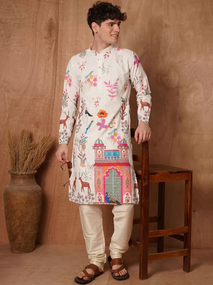 Man wearing a colorful kurta with intricate patterns against a brown background