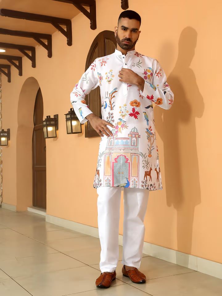 Men’s white kurta with printed monument, peacock, and floral designs – ethnic wear for festive and wedding occasions