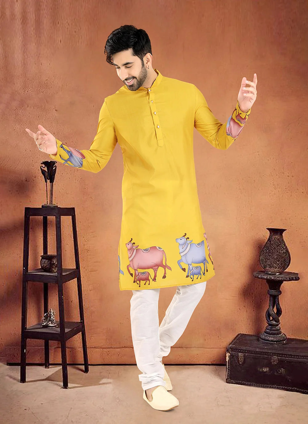 Man Wearing Yellow Festive Kurta with Colorful Cow Prints – Traditional Look